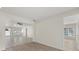 Open living room with tile flooring and view to entry at 5164 Windward Ave, Sarasota, FL 34242