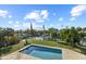 Stunning pool view with canal and lush greenery at 5164 Windward Ave, Sarasota, FL 34242