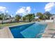 Inviting pool with tiled deck overlooks the canal at 5164 Windward Ave, Sarasota, FL 34242