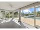 Relaxing screened porch overlooking the canal and pool at 5164 Windward Ave, Sarasota, FL 34242