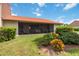 Beautiful backyard showcasing a screened patio and well-maintained lawn at 6542 Draw Ln # 90, Sarasota, FL 34238