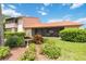 Landscaped backyard with a screened patio and lush greenery at 6542 Draw Ln # 90, Sarasota, FL 34238