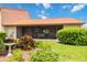 Tranquil backyard oasis featuring a screened patio and manicured landscaping at 6542 Draw Ln # 90, Sarasota, FL 34238