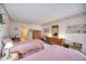 Spacious bedroom with two twin beds and ensuite bathroom access at 6542 Draw Ln # 90, Sarasota, FL 34238