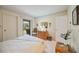 Cozy bedroom with a queen-size bed and private balcony access at 6542 Draw Ln # 90, Sarasota, FL 34238