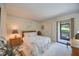 Serene bedroom with a full-size bed and private access to patio at 6542 Draw Ln # 90, Sarasota, FL 34238