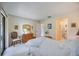 Bright bedroom with a queen-size bed and ensuite bathroom at 6542 Draw Ln # 90, Sarasota, FL 34238