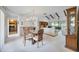 Open concept dining area with adjacent living space and kitchen at 6542 Draw Ln # 90, Sarasota, FL 34238
