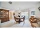 Cozy dining area, perfect for intimate gatherings, with a chandelier and hardwood floors at 6542 Draw Ln # 90, Sarasota, FL 34238