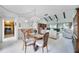 Bright dining room with a view to the living room and backyard at 6542 Draw Ln # 90, Sarasota, FL 34238