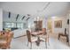 Elegant dining room with a chandelier and access to the living room and patio at 6542 Draw Ln # 90, Sarasota, FL 34238