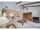 Spacious living room with vaulted ceilings, exposed beams, and a neutral color palette at 6542 Draw Ln # 90, Sarasota, FL 34238