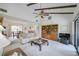 Spacious living room with vaulted ceilings, exposed beams, and a neutral color palette at 6542 Draw Ln # 90, Sarasota, FL 34238