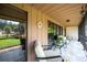 Bright screened patio with comfy seating, offering a peaceful outdoor space at 6542 Draw Ln # 90, Sarasota, FL 34238