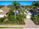 Property view showcasing home's curb appeal and surrounding neighborhood at 7131 Sandhills Pl, Lakewood Ranch, FL 34202