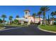 Grand clubhouse entrance with palm trees at 7131 Sandhills Pl, Lakewood Ranch, FL 34202
