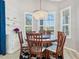 Bright dining room with a round table and a chandelier at 7131 Sandhills Pl, Lakewood Ranch, FL 34202