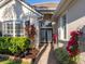 Entryway with double doors and lush landscaping at 7131 Sandhills Pl, Lakewood Ranch, FL 34202