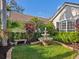 Landscaped garden with fountain and bench at 7131 Sandhills Pl, Lakewood Ranch, FL 34202