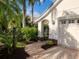 Landscaped walkway to a house with a two-car garage at 7131 Sandhills Pl, Lakewood Rch, FL 34202