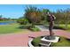Bronze statue of a golfer on a brick paved path at 7131 Sandhills Pl, Lakewood Ranch, FL 34202