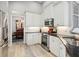 Modern kitchen with white cabinets, granite countertops and stainless steel appliances at 7131 Sandhills Pl, Lakewood Ranch, FL 34202