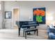Elegant living room featuring hardwood floors, comfortable seating, and large artwork at 7131 Sandhills Pl, Lakewood Ranch, FL 34202