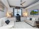 Home office with built-in shelving, desks, and comfortable seating at 7131 Sandhills Pl, Lakewood Ranch, FL 34202