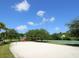 Community playground with sand volleyball and basketball court at 7131 Sandhills Pl, Lakewood Ranch, FL 34202