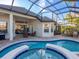 Inviting pool and spa with screened enclosure at 7131 Sandhills Pl, Lakewood Ranch, FL 34202