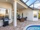 Outdoor oasis with pool, spa, and built-in grill at 7131 Sandhills Pl, Lakewood Ranch, FL 34202