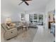 Bright living room with comfy seating and access to a lanai at 7607 Preserves Ct, Sarasota, FL 34243