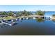 Aerial of waterfront property with boats and calm water at 7705 Alhambra Dr, Bradenton, FL 34209