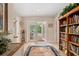Back entry with French doors opening to a patio and built-in shelving at 7705 Alhambra Dr, Bradenton, FL 34209