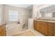 Double vanity bathroom with soaking tub and walk-in shower at 7705 Alhambra Dr, Bradenton, FL 34209