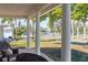 Relaxing covered porch with water views and seating area at 7705 Alhambra Dr, Bradenton, FL 34209