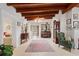 Spacious entryway with hardwood floors, antique furniture, and high ceilings at 7705 Alhambra Dr, Bradenton, FL 34209