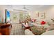 Relaxing living room with comfortable seating and large TV at 7705 Alhambra Dr, Bradenton, FL 34209