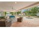 Relaxing patio area with wicker furniture and a view of the backyard at 7705 Alhambra Dr, Bradenton, FL 34209
