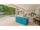 Brick paved patio with seating area, fountain, and covered section at 7705 Alhambra Dr, Bradenton, FL 34209