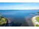 Serene waterfront view with calm water and shoreline at 7705 Alhambra Dr, Bradenton, FL 34209