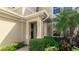 Inviting front entrance with lush landscaping and a charming wreath at 7967 Tybee Ct, Bradenton, FL 34201