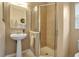 Bathroom with a shower, pedestal sink, and tile flooring at 9203 Winter Harbour Way, Bradenton, FL 34212