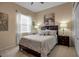 Spacious bedroom with a queen-size bed and nightstands at 9203 Winter Harbour Way, Bradenton, FL 34212