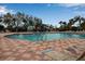 Inviting community pool with plenty of lounge chairs and a water feature at 9203 Winter Harbour Way, Bradenton, FL 34212