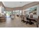 Open concept dining room with view into kitchen and Gathering room at 9203 Winter Harbour Way, Bradenton, FL 34212