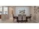 Bright dining room with a large table and modern chandelier at 9203 Winter Harbour Way, Bradenton, FL 34212