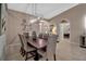 Elegant dining room featuring a large table, chandelier, and neutral decor at 9203 Winter Harbour Way, Bradenton, FL 34212