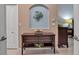 Entryway with console table, decorative wall art, and view into hallway at 9203 Winter Harbour Way, Bradenton, FL 34212