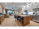 Open concept kitchen with island and stainless steel appliances at 9203 Winter Harbour Way, Bradenton, FL 34212